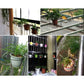 Black metal flower pot stands with potted plants on balcony rails