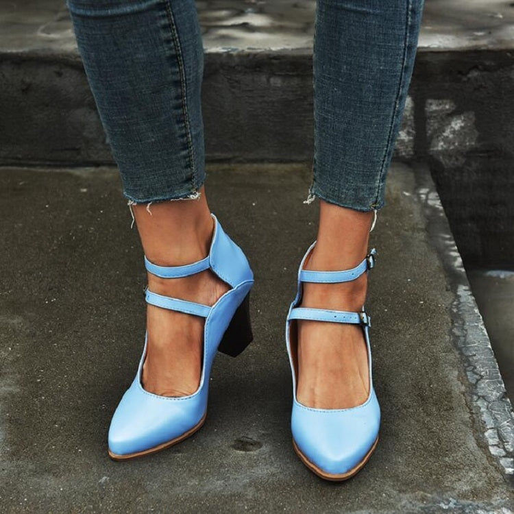 Women’s blue double-buckle heel sandals worn with cropped denim jeans