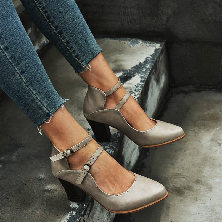 Grey double-buckle block heel pumps with ankle straps and pointed toe