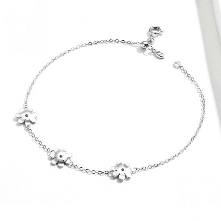 Silver daisy bracelet with multiple flower charms and round link chain