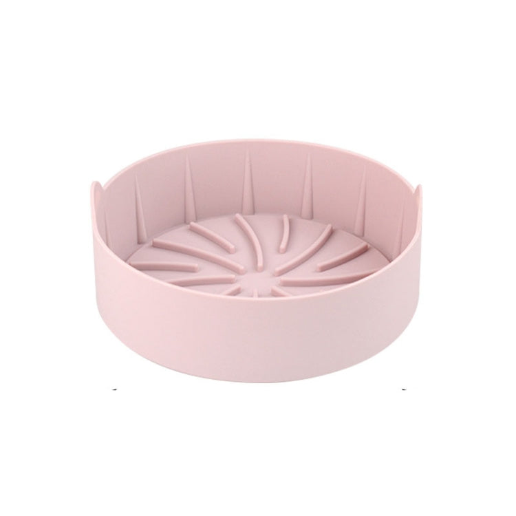 Pink round silicone grill pan insert, ridged radial channels with raised center detail