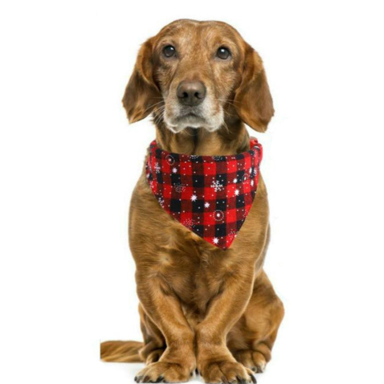 Pet wearing red and black plaid triangle bandana towel with white snowflake pattern
