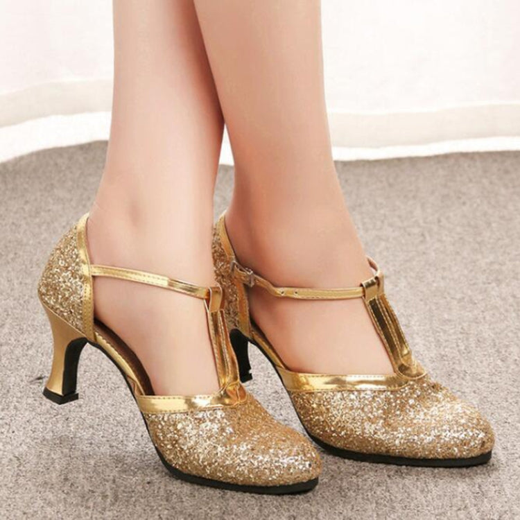 Gold sequined Mary Jane Latin heels showing ankle strap and low block heel
