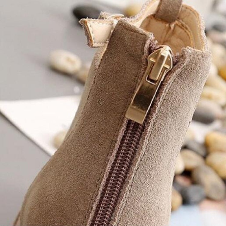 Camel suede ankle boot close-up of side zipper and metal buckle strap