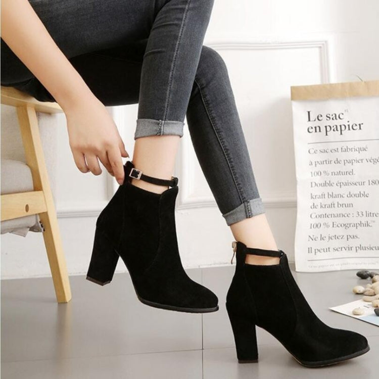 Black suede pointed-toe ankle boots with high block heels and ankle strap