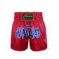 Muay Thai boxing shorts with red fabric and embroidered blue logo text on front