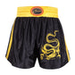 Muay Thai boxing shorts with elastic waistband, black with yellow dragon print and side trim