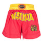 Red boxing shorts with yellow waistband, bold graphic logo, and small flame emblem on leg.