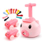 Pink pig balloon car toy with colorful accessory pieces and two small pig cars