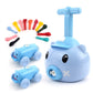 Blue pig-shaped balloon car toy with two small pig cars and colorful accessory parts