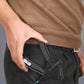 Black hand gripper in use, held by a person with a spring-loaded handle