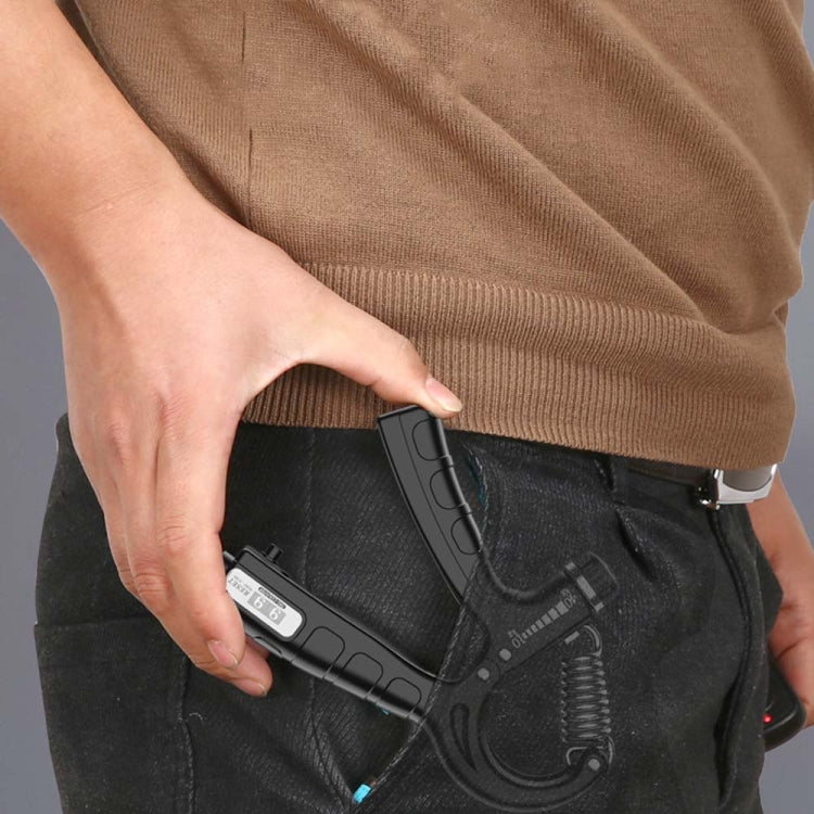 Black hand gripper in use, held by a person with a spring-loaded handle