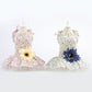 Pet daisy-print dress set: one with yellow daisy and one with blue daisy centerpiece