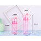 Pink translucent spray water bottle with lid and mist nozzle, shown with dimensions