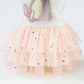 Pet skirt tutu with pale pink mesh layers and star prints, featuring a bunny applique