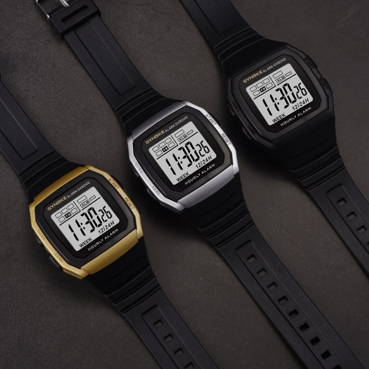 Three digital sports watches on black straps: black, silver, and gold-toned cases