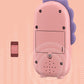 Back of a pink dinosaur toy smartphone with speaker and port