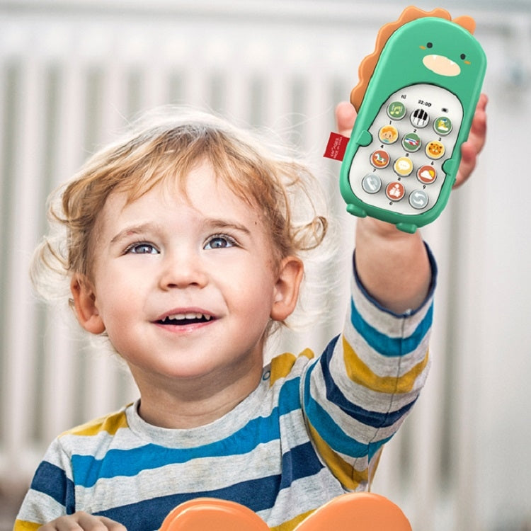 Green dinosaur toy smartphone held up by a smiling toddler