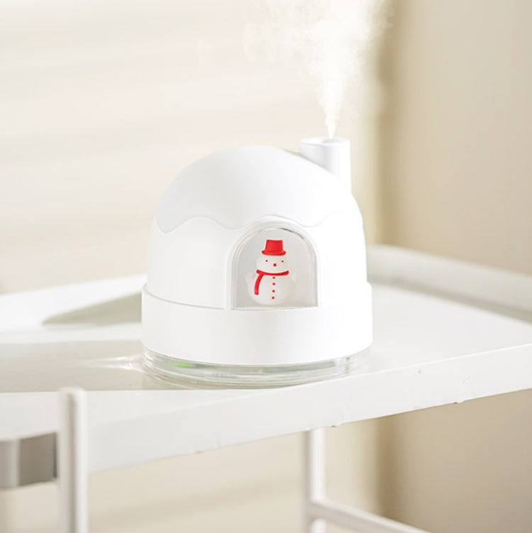 White snowman humidifier night light on shelf, red snowman icon in front dome.