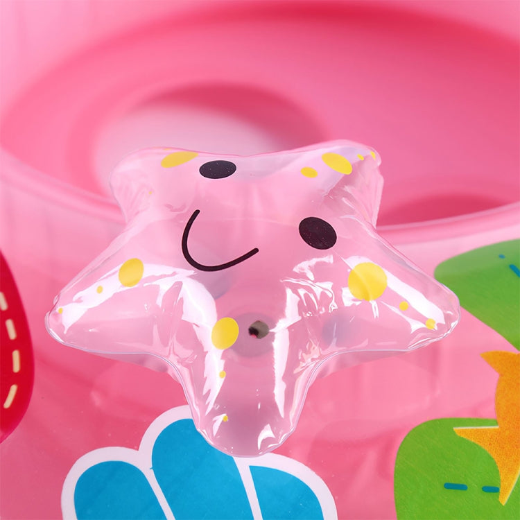 Pink inflatable mushroom seat with smiling animal face graphic