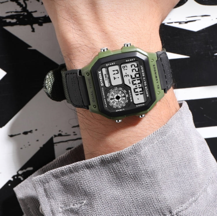 SYNOKE digital wristwatch on wrist with green case and black fabric strap