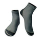 Dark gray neoprene snorkeling socks with light gray seams and textured sole