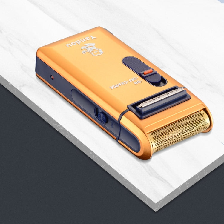 Orange Yandou electric shaver with foil head and on/off slider, angled view