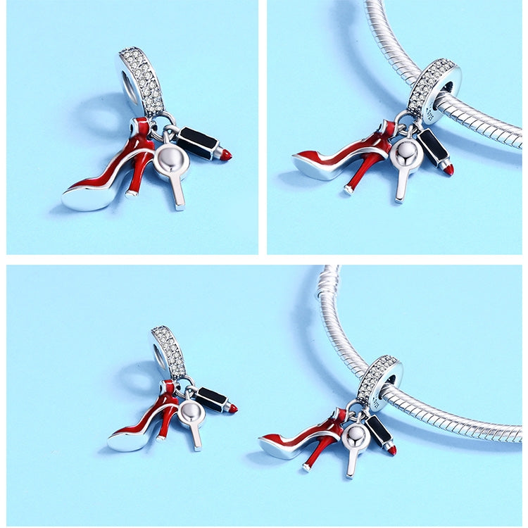 Sterling silver charm with red high-heel enamel and black accents on a connected loop