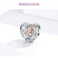 Heart-shaped charm bead featuring a four-leaf clover design with rose gold and CZ accents.