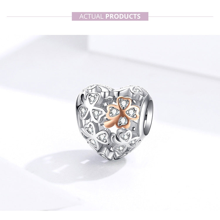 Heart-shaped charm bead featuring a four-leaf clover design with rose gold and CZ accents.