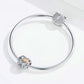 Snake bracelet with heart-shaped charm bead and rose gold clover center CZ sparkle details.