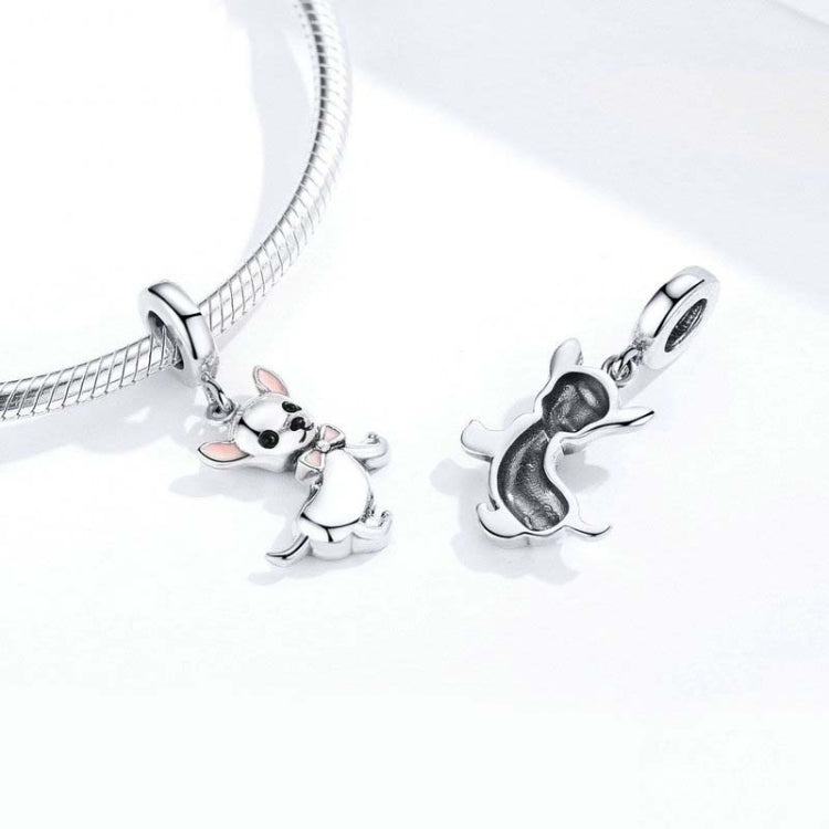 Chihuahua dog charm pendant on a silver bracelet, enamel bow detail