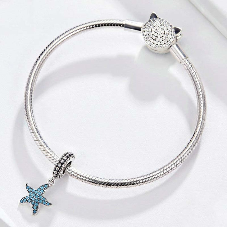 Sterling silver snake chain bracelet with blue starfish charm