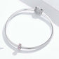 Silver snake bracelet featuring a pink enamel flower charm bead near the clasp