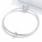 Silver snake-chain bracelet with 925 oval bead charm and round textured spacer