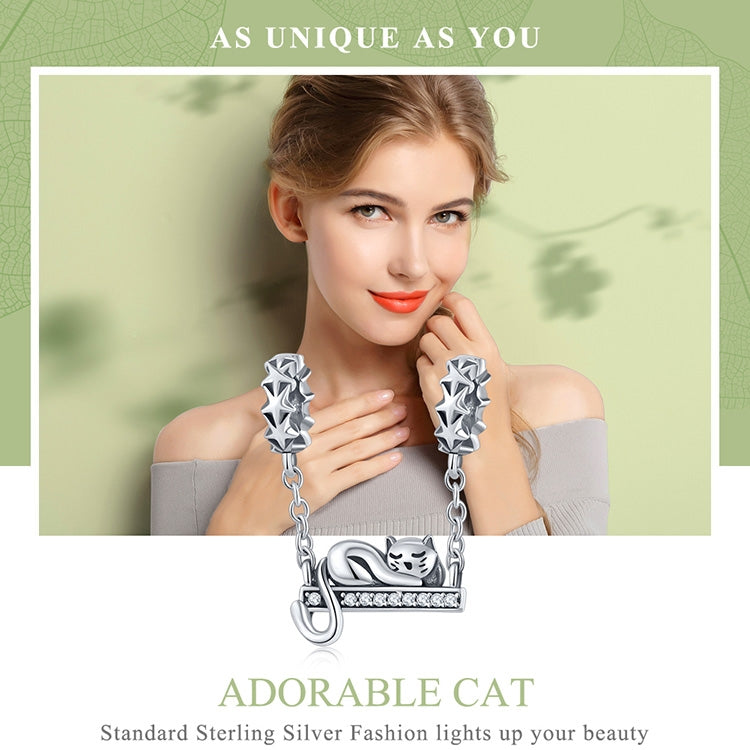 Sterling silver cat necklace pendant with CZ-studded arched bar, worn by model