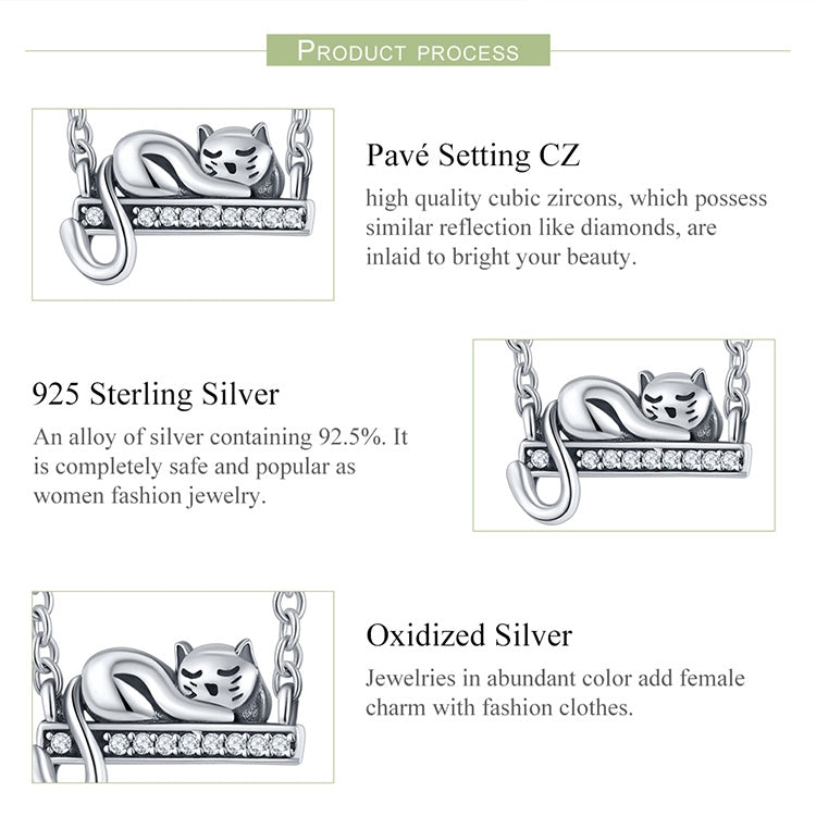 Sterling silver cat necklace pendant close-up with CZ detail on arched bar