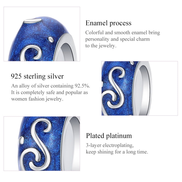 Blue enamel bead charm with silver swirl S and small white dots on the metal rim