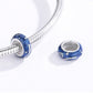 Blue star-glow enamel charm bead on a silver snake chain