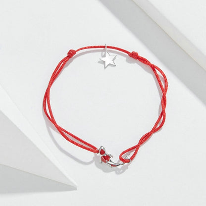 Red string bracelet with sterling silver star charm and knot adjustable cord