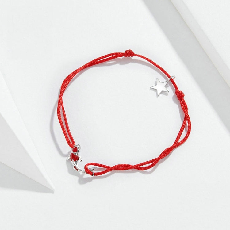 Red string bracelet with sterling silver star charm and small silver charm at clasp