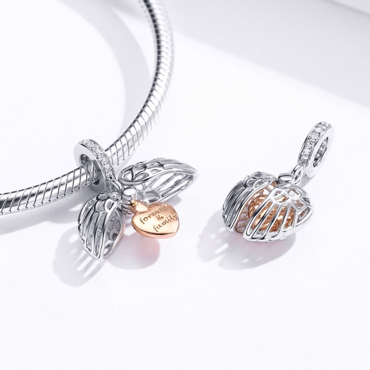Two sterling silver angel wing heart charms on a snake bracelet with rose-gold heart centers