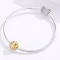 Silver snake bracelet with gold daisy charm bead and clasp