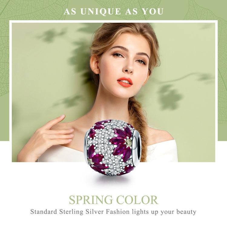 Round purple gemstone bead charm on a silver snake bracelet with spring clasp