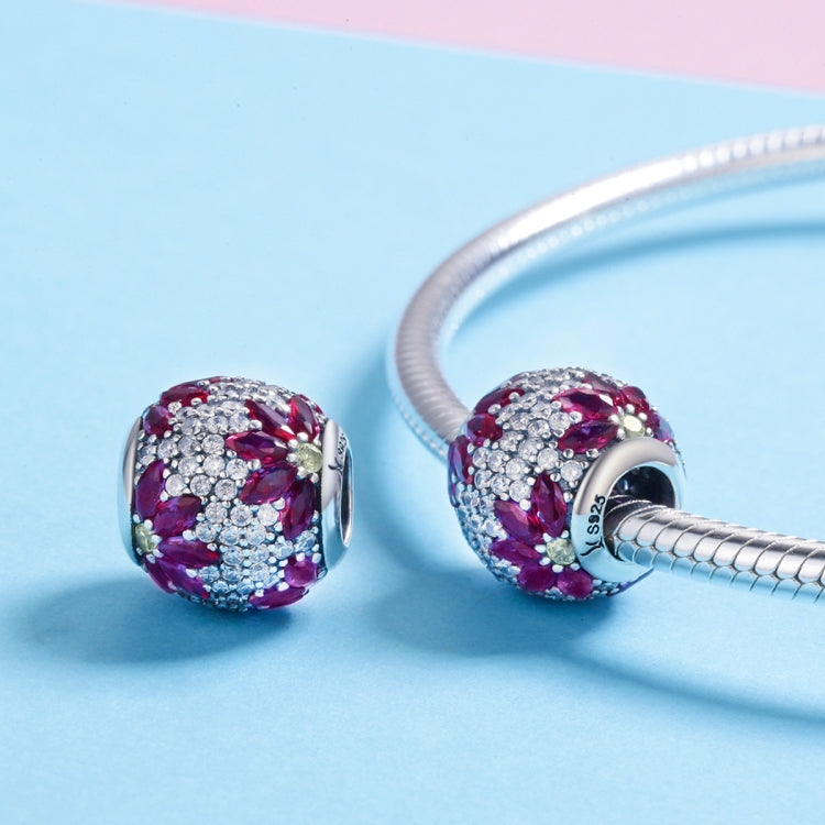 Pair of round purple gemstone bead charms on silver snake bracelet