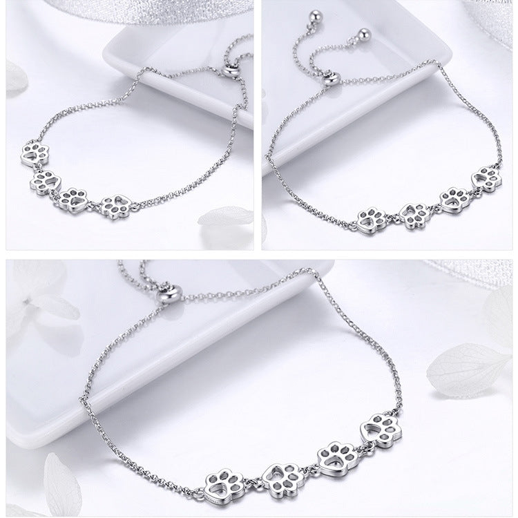 Sterling silver paw charm bracelet shown from multiple angles, with extender clasp