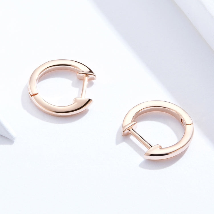 Rose gold hoop earrings with hinged clasp and smooth polished finish