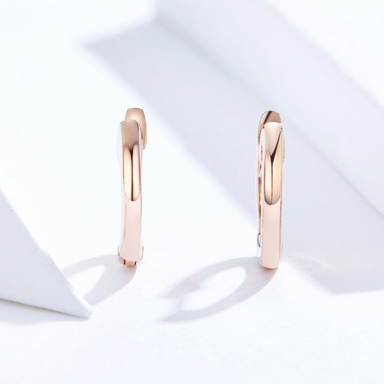 Rose gold hoop earrings, slim profile with hinged ear back, polished finish
