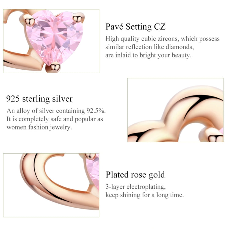 Close-up detail of pink heart CZ in rose gold heart setting