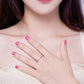 Sterling silver 925 pattern band ring worn on hand with glossy pink nails